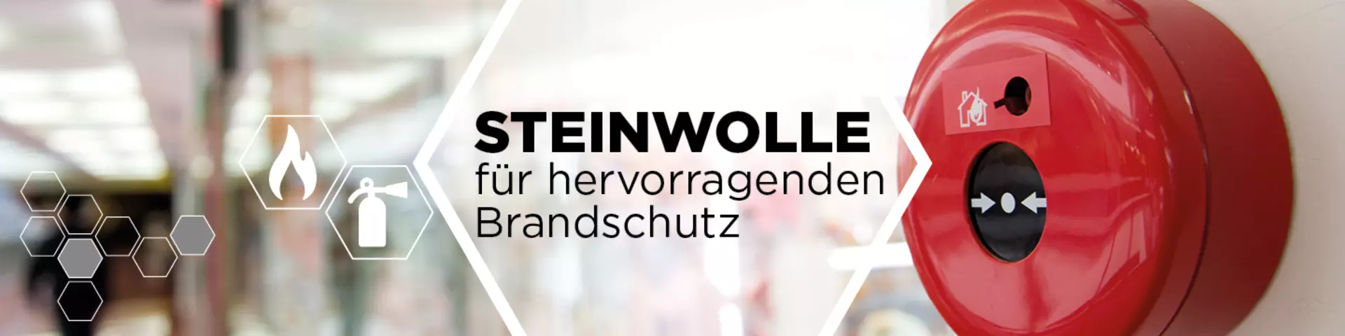 Steinwolle, im Hintergrund ein Brandmelder